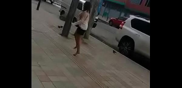  Colombian puta walks barefoot in street for money